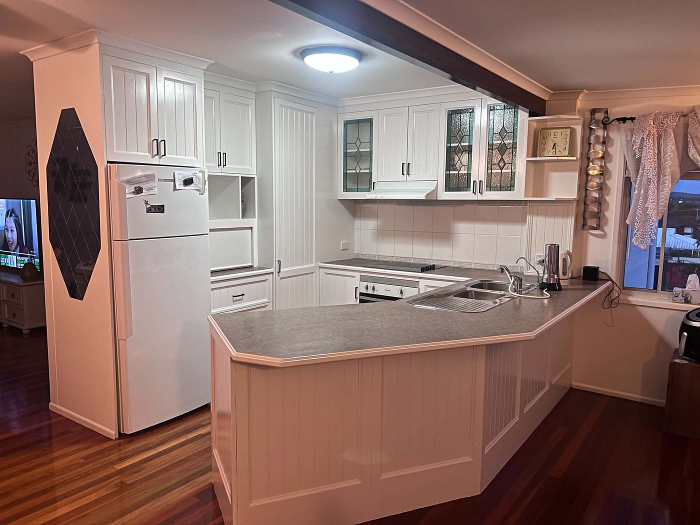 Kitchen repainted bright white by A.M.A Premium Painting Services